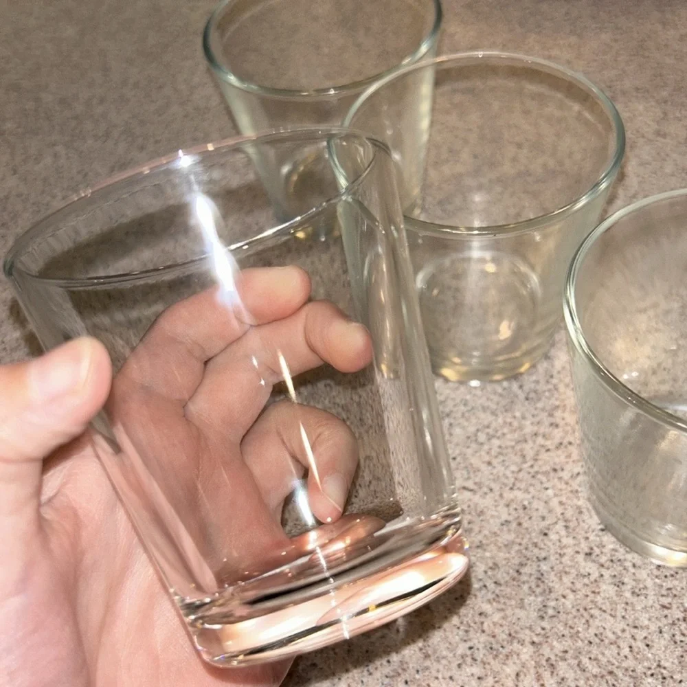 Four small water bottles
